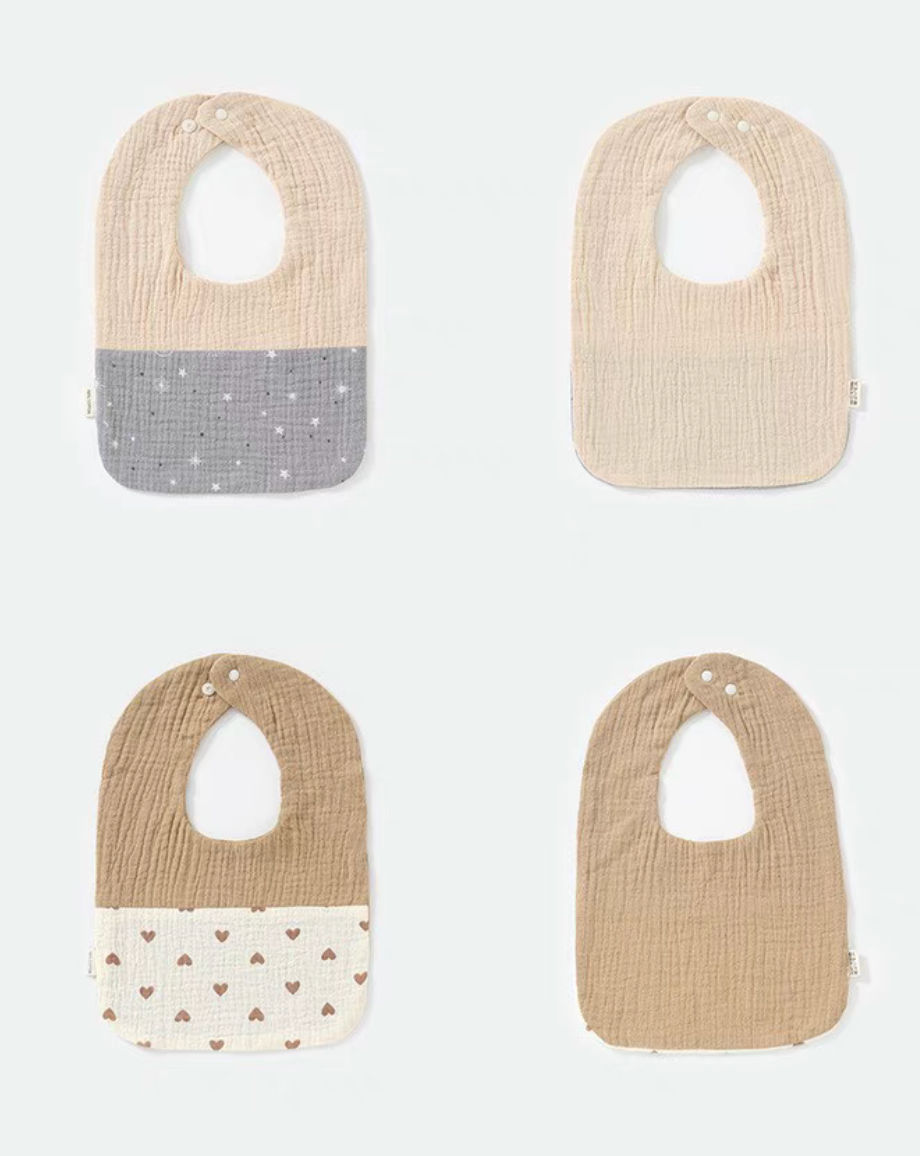 U-neck cotton gauze baby bibs mixed set overview with printed and solid designs including star print, heart print, and khaki tones