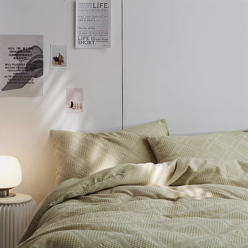 Spring green ultra-soft organic cotton waffle weave bedding set styled in minimalist bedroom with textured duvet cover