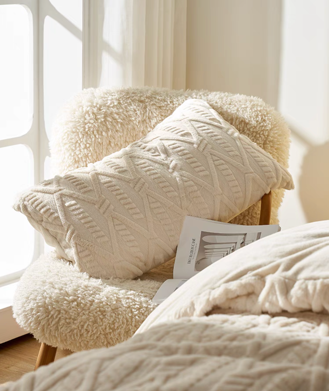 Ivory white VelourRest rex rabbit fur decorative pillow placed on soft boucle chair with plush bedding texture