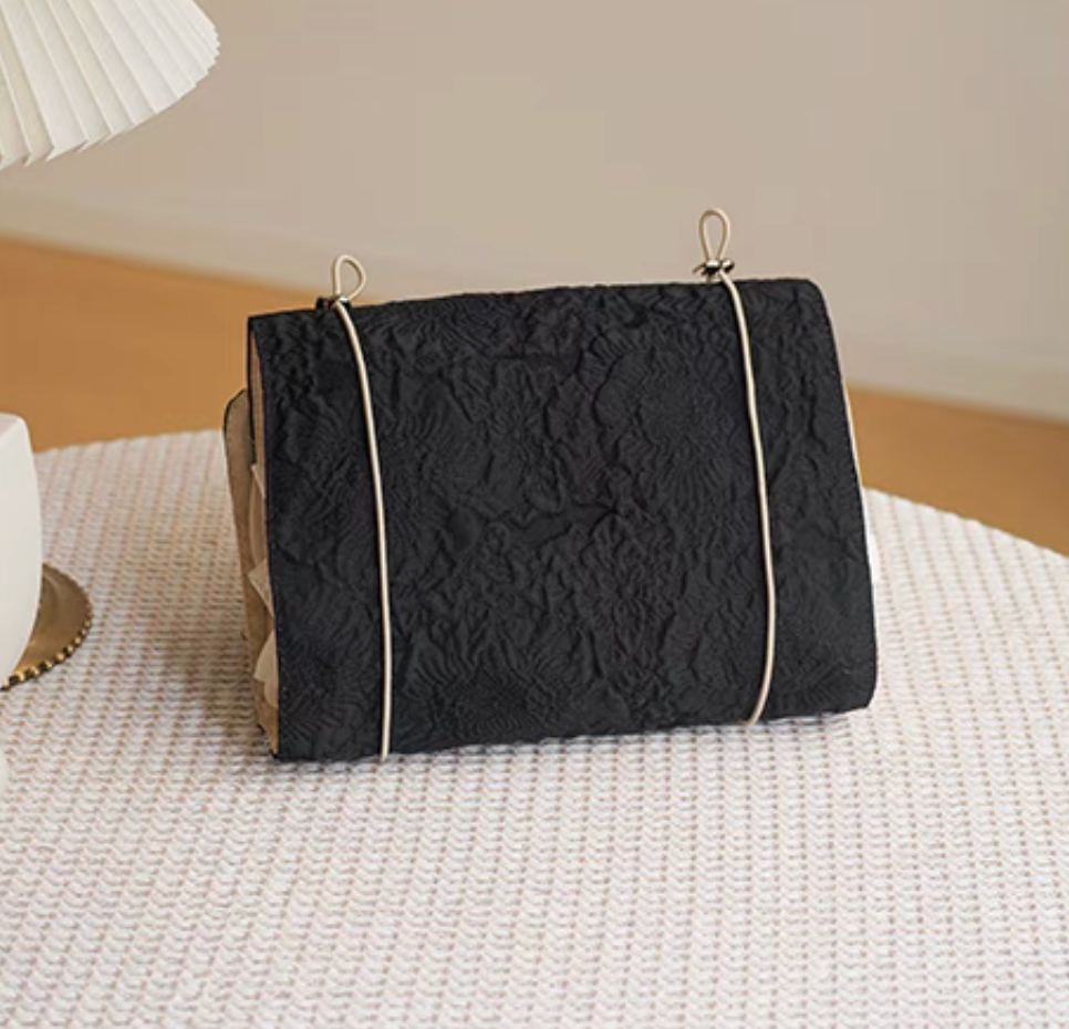 Vintage Chic Waterproof Travel Makeup Bag in black color side angle view highlighting structured shape and expandable design