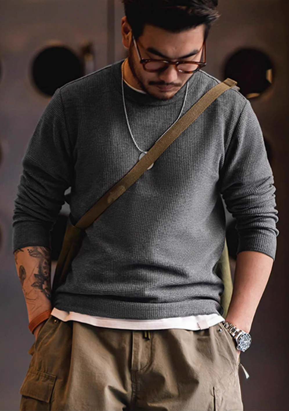 Charcoal waffle knit heavyweight crew sweatshirt worn by model front view styled with cargo pants and shoulder bag