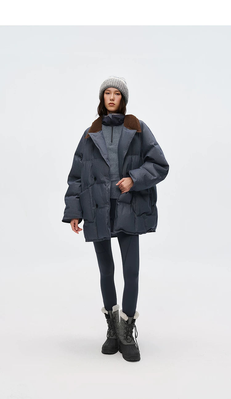Slate blue denim puffer peacoat worn open with notched lapels and patch pockets