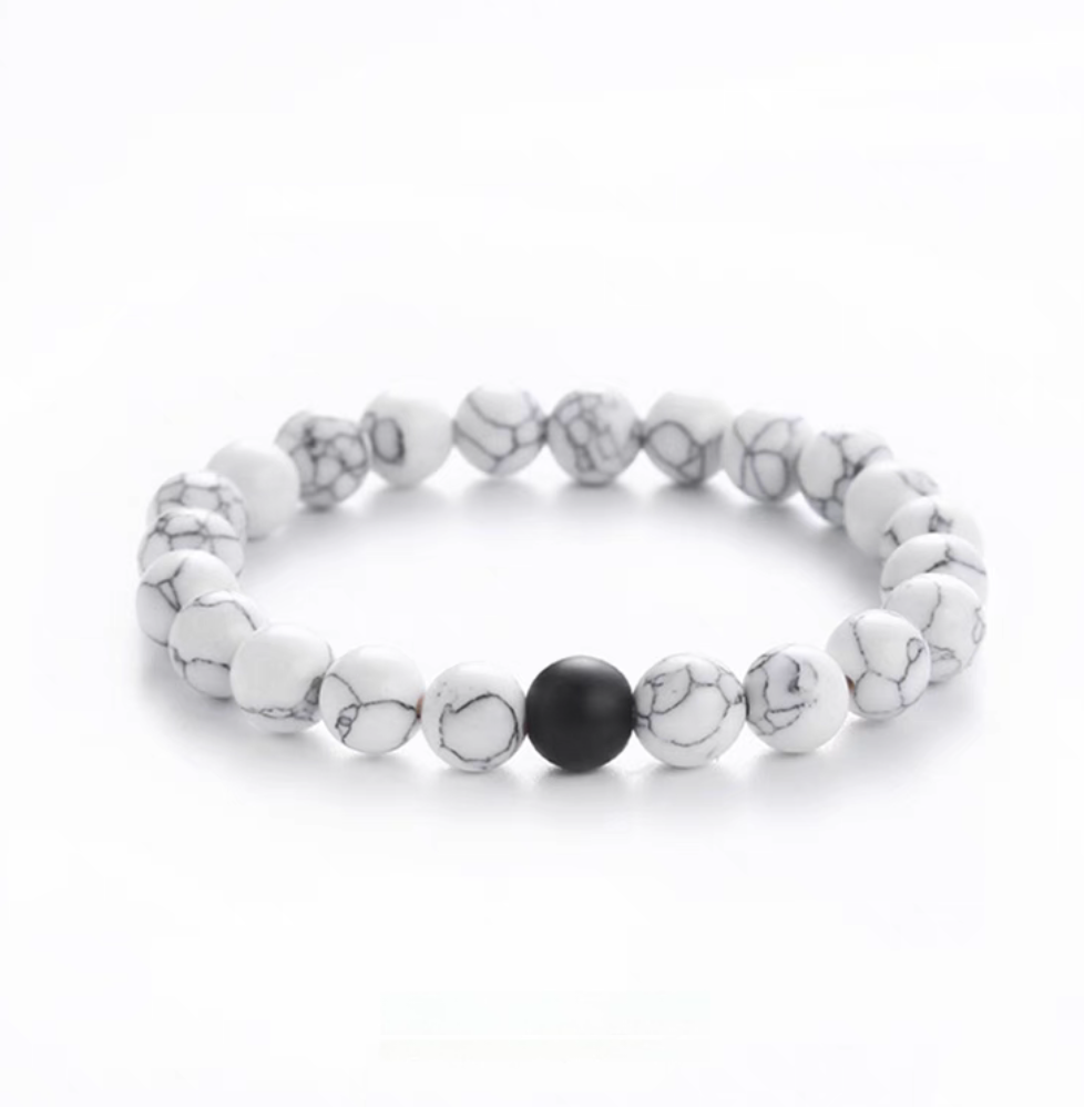 White turquoise minimal bead bracelet with gray veining and a central matte black accent bead