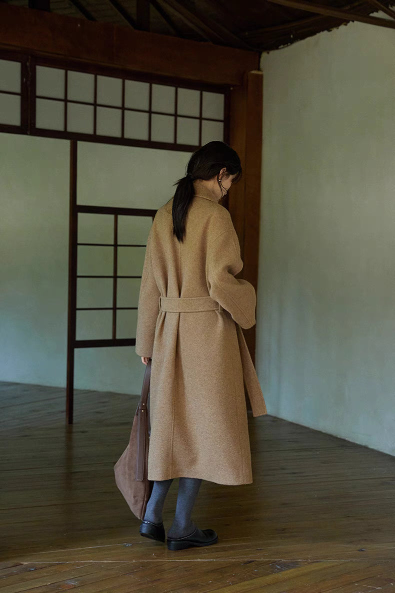 Back view of khaki long Willow Lane Wool Coat showing removable sash belt and clean tailored silhouette for refined winter layering