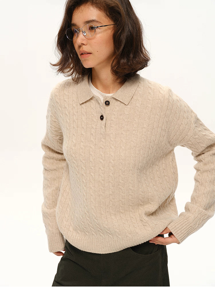 Model wearing beige cable-knit wool polo sweater, front view with hands in pockets