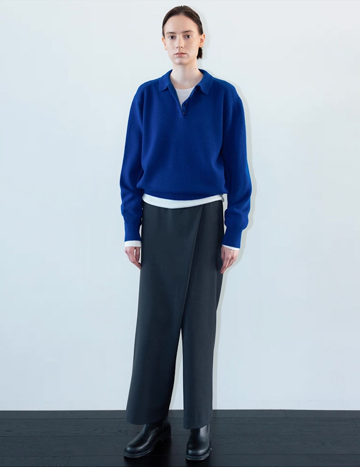 Full outfit view of wool cashmere polo sweater in dark blue