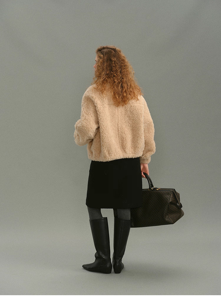 Full back view of cream beige wool high-neck jacket with skirt and boots