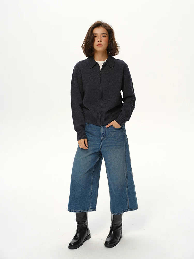Deep navy wool zip collar knit jacket styled with wide-leg jeans and black boots, full body view