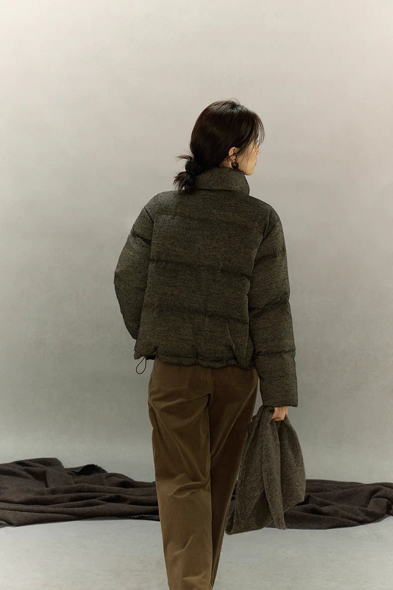 Back view of wool-blend down jacket showing hip-length cut and hem drawcord.