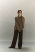 Model wearing light coffee brown cashmere blend sweater, relaxed fit full body view.