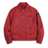 lat lay of men’s rust red rodeo jacket showing patch and front pockets