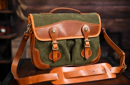 Angled view showing vintage leather and waxed canvas messenger bag