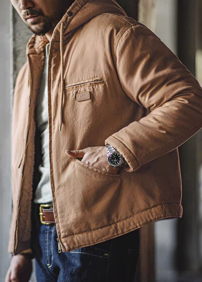 Man wearing khaki sherpa-lined jacket with hand in pocket, casual outfit