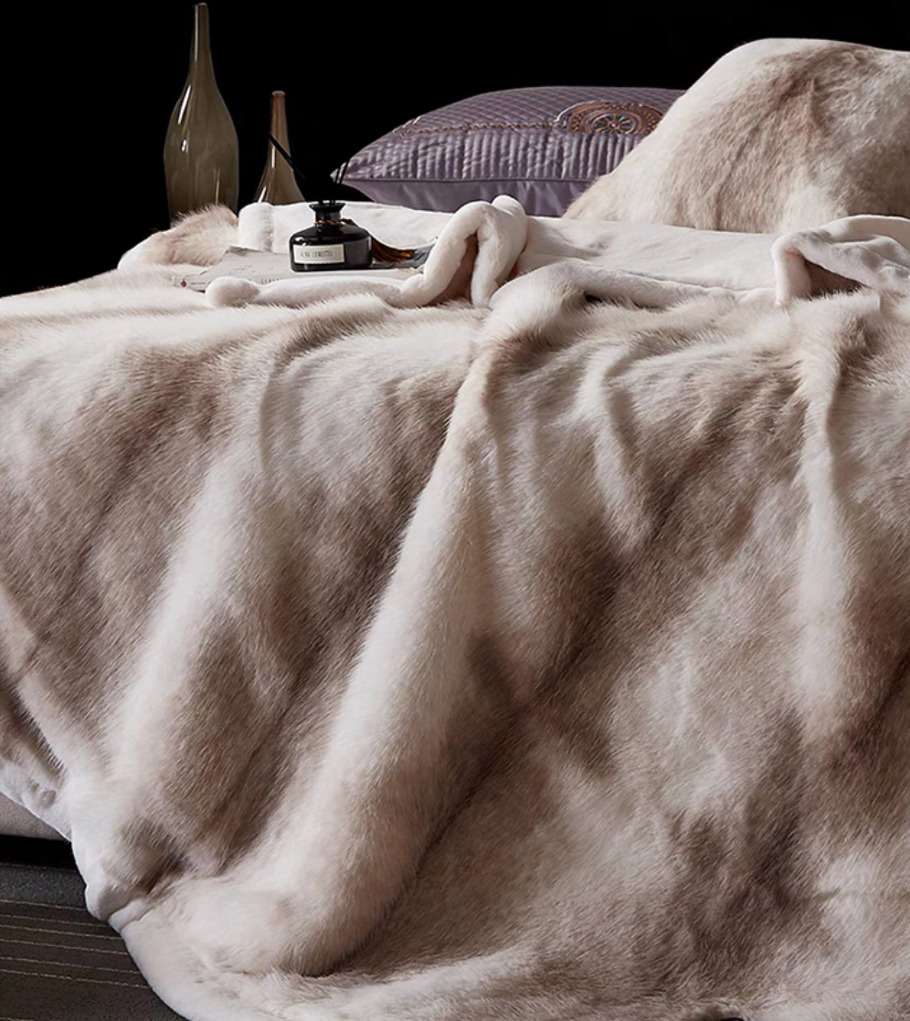 White Tiger Print long-pile faux fur luxe throw draped across bed with bold striped pattern and fluffy texture