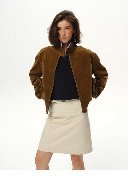 model wearing coffee brown corduroy jacket with hands in pockets