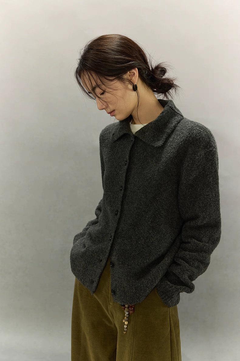 Side profile view of wool cardigan in charcoal gray with soft brushed surface and clean collar detail.