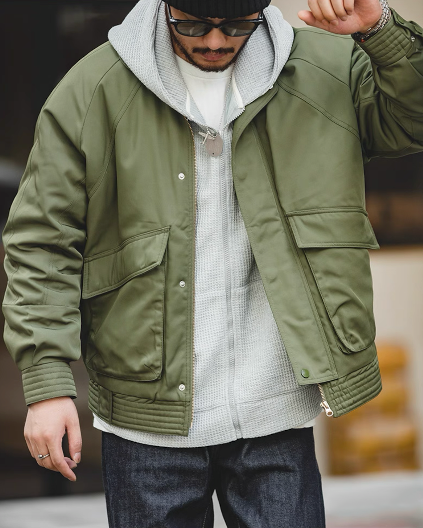 Army green Flight Jacket 074 layered over gray hoodie streetwear look