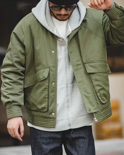 Army green Flight Jacket 074 layered over gray hoodie streetwear look