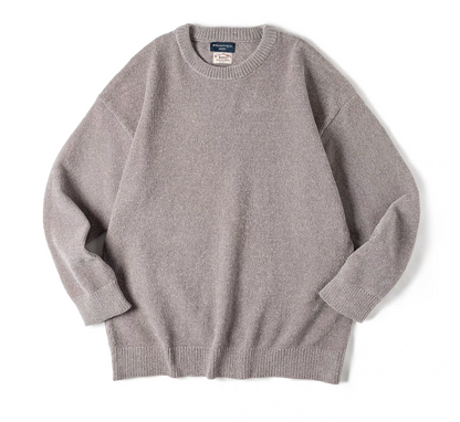 Light gray chenille knit sweater flat lay showing ribbed cuffs and hem
