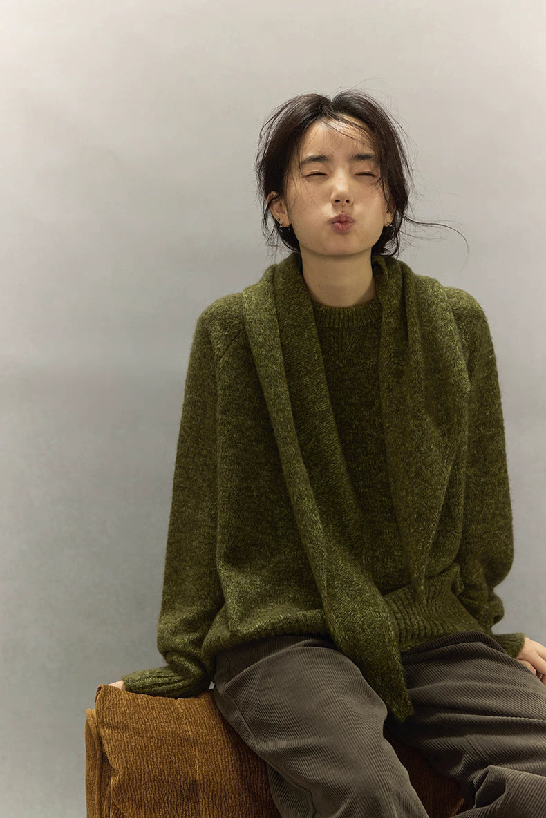 Model in moss green sweater, smiling softly with cozy winter mood.