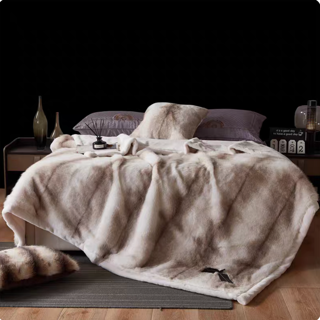 White Tiger Print long-pile faux fur luxe throw spread over bed with dramatic striped pattern and cozy styling