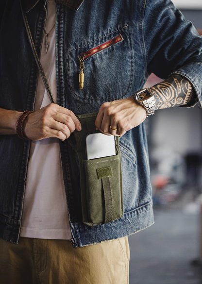 Model using M-16 Field Pouch Mini to store phone and wallet