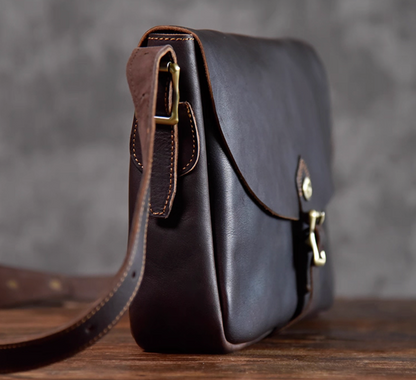 Side profile of the Italian full-grain leather crossbody bag highlighting clean stitching and slim shape.
