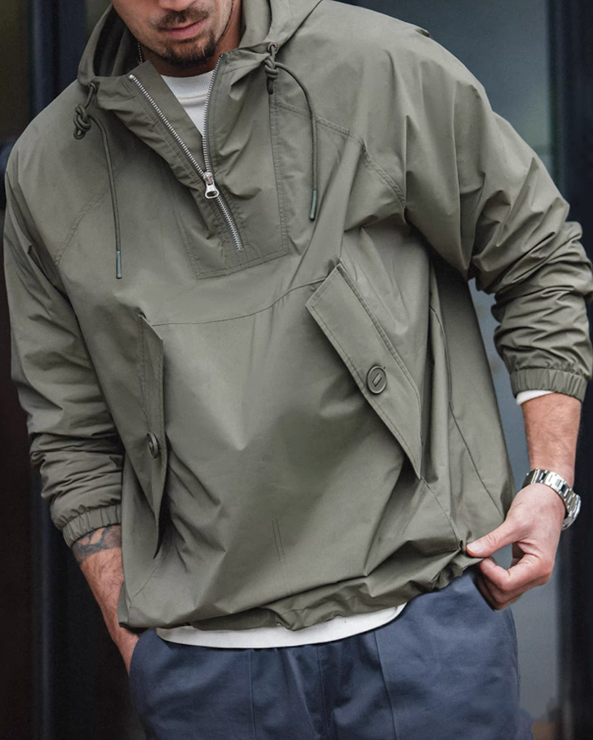 Model styling M43 military windbreaker with jeans and t-shirt