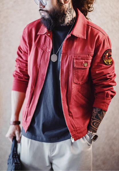 Man styling rust red cotton jacket with black tee and watch