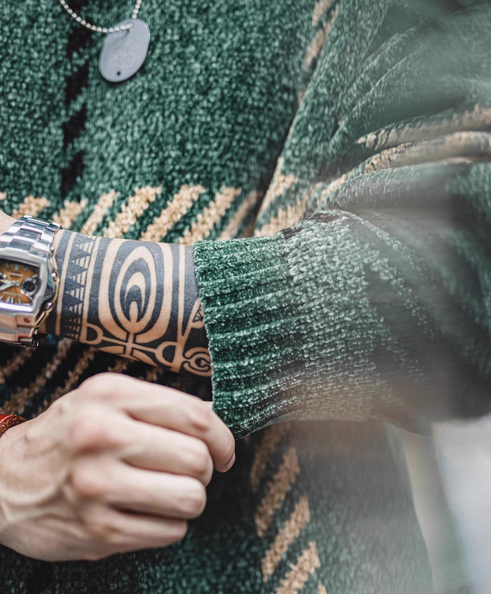 Close-up of chenille sweater sleeve cuff, ribbed knit texture detail