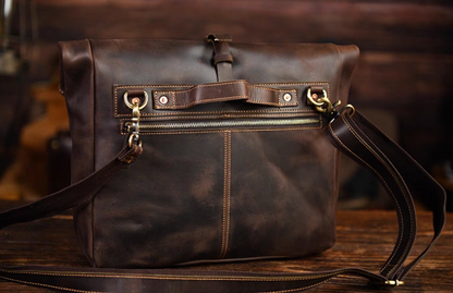 Back angle of messenger bag showing durable copper rivets and reinforced stitching