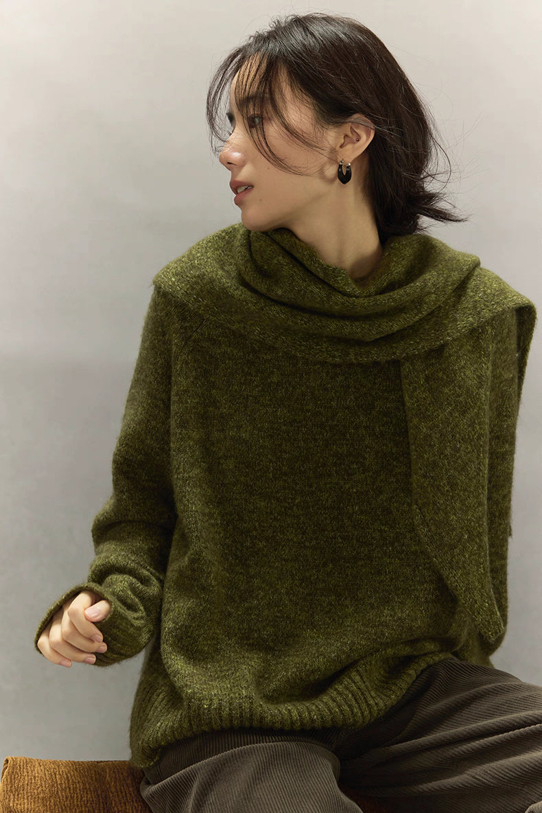 Side view of moss green cashmere wool sweater highlighting textured surface and ribbed hem.