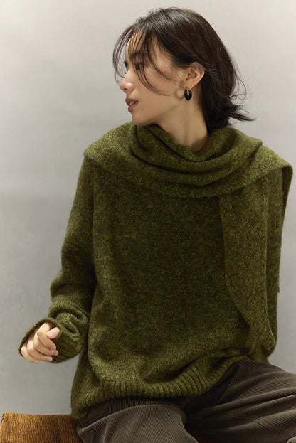 Side view of moss green cashmere wool sweater highlighting textured surface and ribbed hem.