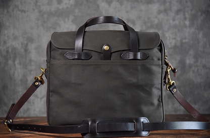Charcoal black waxed canvas briefcase with brass hardware and leather strap