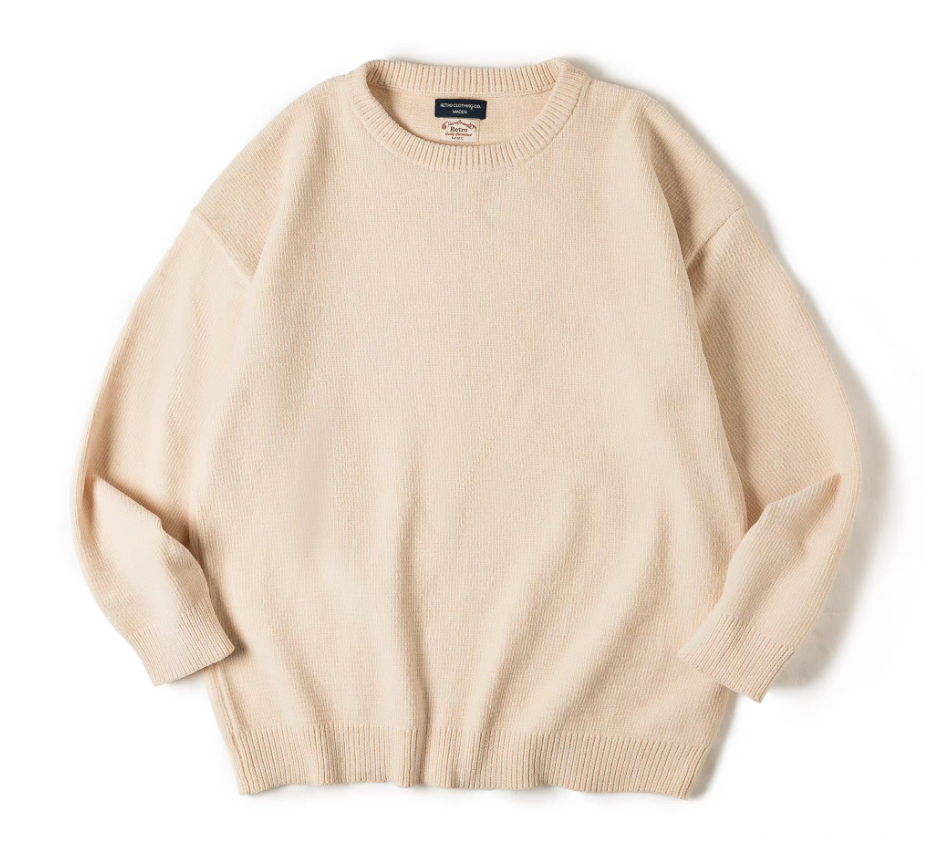 Cream white chenille knit sweater flat lay showing minimal, cozy texture