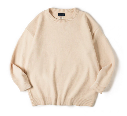Cream white chenille knit sweater flat lay showing minimal, cozy texture