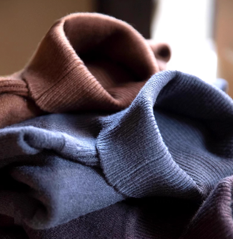 Close-up of mocha brown and dusty blue knit collars showing soft fine texture
