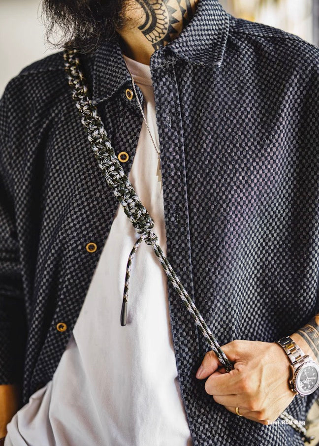 Braided paracord strap detail of Ameikaji crossbody bag