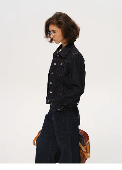 side profile view of woman wearing dark indigo denim jacket