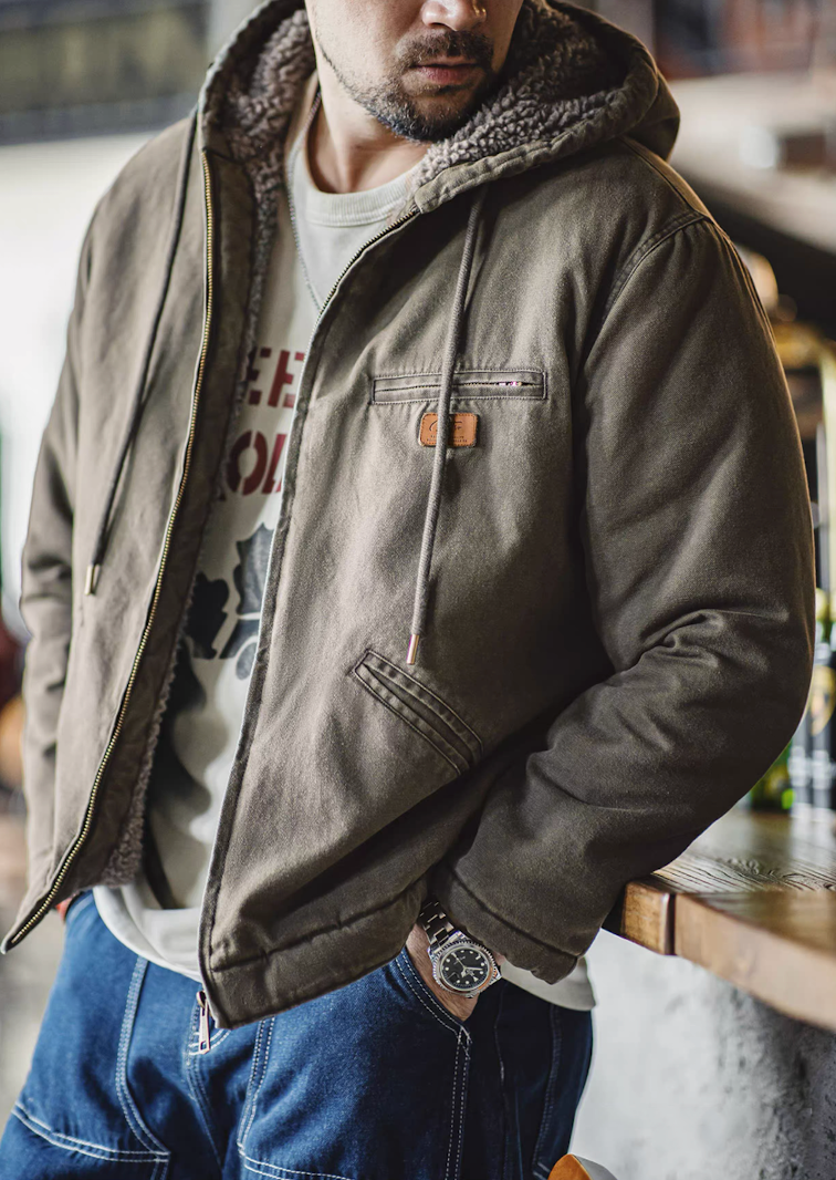 Dark green sherpa-lined hooded jacket worn open with visible lining