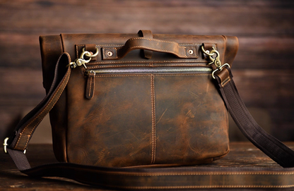 Rear view of coffee brown crazy horse leather bag with zipper and handle details