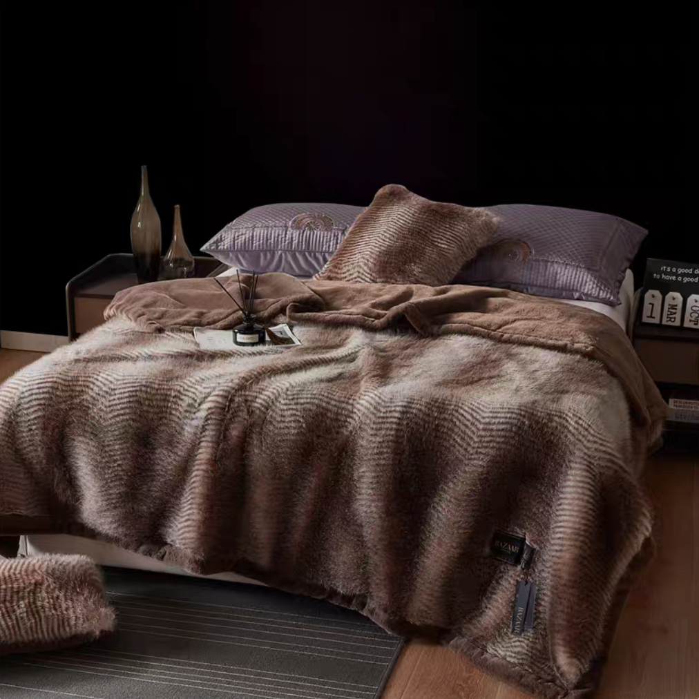 Patterned Brown long-pile faux fur luxe throw spread on bed with deep brown striped pattern and plush finish