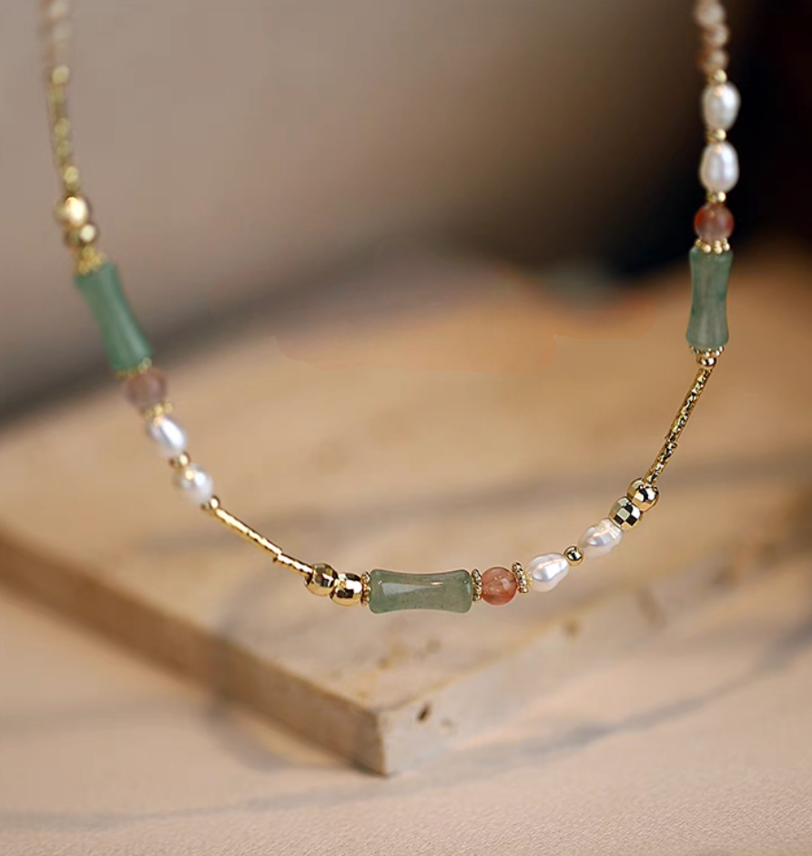 Bamboo pearl necklace with aventurine beads freshwater pearls and agate close-up showing green bamboo-shaped stones and gold accents