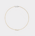 Baroque pearl and stone necklace flat lay featuring natural freshwater pearls with small stone beads and minimalist silver clasp
