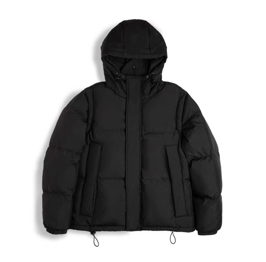 Versatile Parka in black shown flat with hood and detachable sleeves
