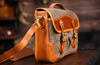 Side profile of khaki grey waxed canvas satchel highlighting craftsmanship