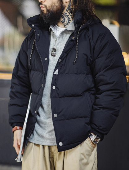 Side view of model wearing dark blue Urban Shield Jacket with zipper and snap closure