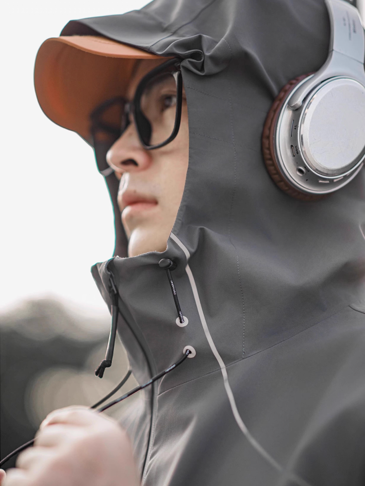 Close-up of grey LIGHTSABER reflective hood with adjustable drawcords