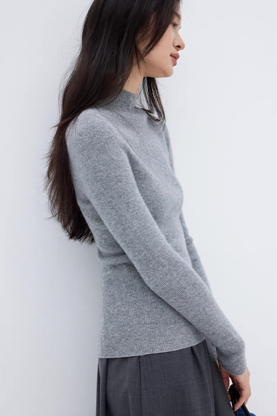 Side profile of soft gray cashmere sweater with slim fit design, classic winter fashion