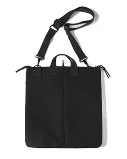 Charcoal black canvas tote bag back view showing clean panel design and adjustable shoulder strap.